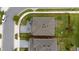 Aerial view of the backyard, roof, and surrounding green lawn of this home at 1335 Greenfield Loop, Kissimmee, FL 34747