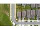 An aerial view showcasing the roof, backyard and surrounding lawn of this charming home at 1335 Greenfield Loop, Kissimmee, FL 34747