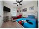 bedroom featuring two twin beds, ceiling fan, and fun cartoon decorations at 1335 Greenfield Loop, Kissimmee, FL 34747