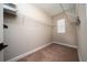 Walk-in closet with carpeted floors, wire shelving, and natural light from a window at 1335 Greenfield Loop, Kissimmee, FL 34747