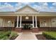 Front entrance to clubhouse, featuring brick columns and a decorative gate at 1335 Greenfield Loop, Kissimmee, FL 34747