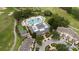 Beautiful aerial shot of the community clubhouse, pool and adjacent golf course at 1335 Greenfield Loop, Kissimmee, FL 34747