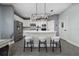Modern kitchen featuring white cabinets, a spacious island, and sleek stainless steel appliances at 1335 Greenfield Loop, Kissimmee, FL 34747