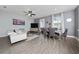 Inviting living area with dining area boasting stylish furnishings and ample natural light at 1335 Greenfield Loop, Kissimmee, FL 34747