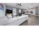 Open-concept living room with modern decor, and seamless flow to the adjacent kitchen at 1335 Greenfield Loop, Kissimmee, FL 34747