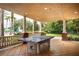 Covered outdoor area with a ping pong table, perfect for recreation at 1335 Greenfield Loop, Kissimmee, FL 34747