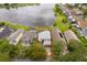 Aerial view of the property showing its proximity to a lake and surrounding neighborhood at 13525 Mallard Cove Blvd, Orlando, FL 32837