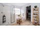 Bathroom featuring a glass shower, tub, and a view into the walk-in closet at 13525 Mallard Cove Blvd, Orlando, FL 32837