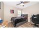 Bedroom with ceiling fan, wood floors and view of the street at 13525 Mallard Cove Blvd, Orlando, FL 32837