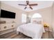 Bedroom featuring wood floors, ceiling fan and natural light at 13525 Mallard Cove Blvd, Orlando, FL 32837