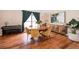 Dining room features hardwood floors, natural light, and is adjacent to the piano at 13525 Mallard Cove Blvd, Orlando, FL 32837