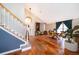Bright and airy foyer boasts wood floors and staircase with lots of natural light at 13525 Mallard Cove Blvd, Orlando, FL 32837