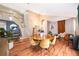 Open-concept living room featuring vaulted ceilings, hardwood floors, and staircase at 13525 Mallard Cove Blvd, Orlando, FL 32837