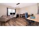 Spacious office features wood floors, modern lighting, and a large window at 13525 Mallard Cove Blvd, Orlando, FL 32837