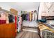 Walk-in closet with an array of shelving for clothes, shoes, and other storage at 13525 Mallard Cove Blvd, Orlando, FL 32837