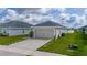 Charming single-story home featuring a spacious two-car garage and a well-manicured lawn at 1719 Daystar Dr, Haines City, FL 33844