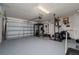 Spacious garage converted into a home gym, complete with weightlifting equipment and ample space at 1719 Daystar Dr, Haines City, FL 33844