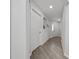Bright hallway with hardwood floors and white doors gives a clean and inviting entrance at 1719 Daystar Dr, Haines City, FL 33844