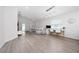 Spacious living room with vaulted ceiling, plush seating, and a well-lit workspace by the window at 1719 Daystar Dr, Haines City, FL 33844