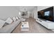 Comfortable living room offers a spacious layout with modern furniture, an open kitchen view, and ample natural light at 1719 Daystar Dr, Haines City, FL 33844