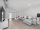Inviting living room featuring a comfortable gray sofa, natural light, and an open layout at 1719 Daystar Dr, Haines City, FL 33844