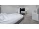 A view of the main bedroom and ensuite with white linens and gray accents at 1719 Daystar Dr, Haines City, FL 33844