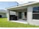 View of the outdoor kitchen on the covered patio, offering seamless indoor-outdoor living at 1719 Daystar Dr, Haines City, FL 33844