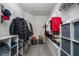 Organized walk-in closet with shelving, hanging rods, and storage cubes at 1719 Daystar Dr, Haines City, FL 33844