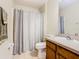 Bathroom featuring a shower-tub combo and a single sink vanity at 1912 Manatee Ln, Poinciana, FL 34759