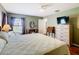 Relaxing bedroom featuring hardwood floors, ample closet space, and natural light throughout at 1912 Manatee Ln, Poinciana, FL 34759