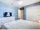 Comfortable bedroom with hardwood floors, ceiling fan, closet, and white dresser at 1912 Manatee Ln, Poinciana, FL 34759