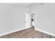Spacious bedroom boasting modern flooring, neutral walls, and an open door at 2 Dogwood Radl, Ocala, FL 34472
