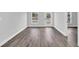 Bedroom featuring luxury vinyl flooring, white walls, and a back door with clear views to the outdoors at 2 Dogwood Radl, Ocala, FL 34472