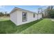 Exterior view showcasing the home's clean lines and well-maintained lawn at 2 Dogwood Radl, Ocala, FL 34472