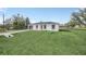 Charming home showcasing a lush lawn, clean exterior and convenient driveway at 2 Dogwood Radl, Ocala, FL 34472