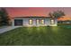 Charming single-story home featuring a modern design, fresh landscaping, and a gray painted garage at 2 Dogwood Radl, Ocala, FL 34472