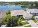 Beautiful lakefront property with lush landscaping and a well-maintained exterior at 201 Largo Dr, Kissimmee, FL 34759