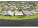 Real estate showcasing lakeside location and stunning community setting with mature trees at 201 Largo Dr, Kissimmee, FL 34759