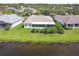 The home features a beautiful lakeside view and a well-maintained lawn at 201 Largo Dr, Kissimmee, FL 34759