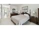 Bedroom showcasing a wooden bed frame, neutral walls, carpet floors, and two side tables with lamps at 201 Largo Dr, Kissimmee, FL 34759