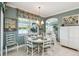 Dining area features a round table and seating for eight with views of the lake at 201 Largo Dr, Kissimmee, FL 34759