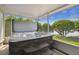 Outdoor hot tub with stone base and steps, set against a backdrop of lush landscaping and lake views at 201 Largo Dr, Kissimmee, FL 34759