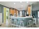 Spacious kitchen featuring bar seating, modern appliances, and ample counter space at 201 Largo Dr, Kissimmee, FL 34759