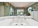 Kitchen with white double sink overlooking the dining area and outdoor scenery at 201 Largo Dr, Kissimmee, FL 34759