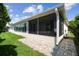 The screened-in patio provides an insect-free outdoor space for relaxation and entertainment at 201 Largo Dr, Kissimmee, FL 34759