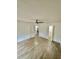 Room featuring ceiling fan, light-colored floors, and two doorways to other areas in the house at 2031 Balboa Way, Kissimmee, FL 34741