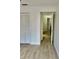 Bright bedroom with white walls, closet, and doorway view showcases the home's layout at 2031 Balboa Way, Kissimmee, FL 34741