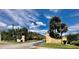 Community entrance sign that reads 'Royale Bermuda' with tropical foliage around the area at 2031 Balboa Way, Kissimmee, FL 34741