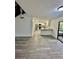 Open concept kitchen with white cabinetry, stainless steel appliances and a modern countertop at 2031 Balboa Way, Kissimmee, FL 34741