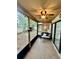 Enjoy outdoor living on this screened-in porch with a ceiling fan and ample space for seating at 2031 Balboa Way, Kissimmee, FL 34741